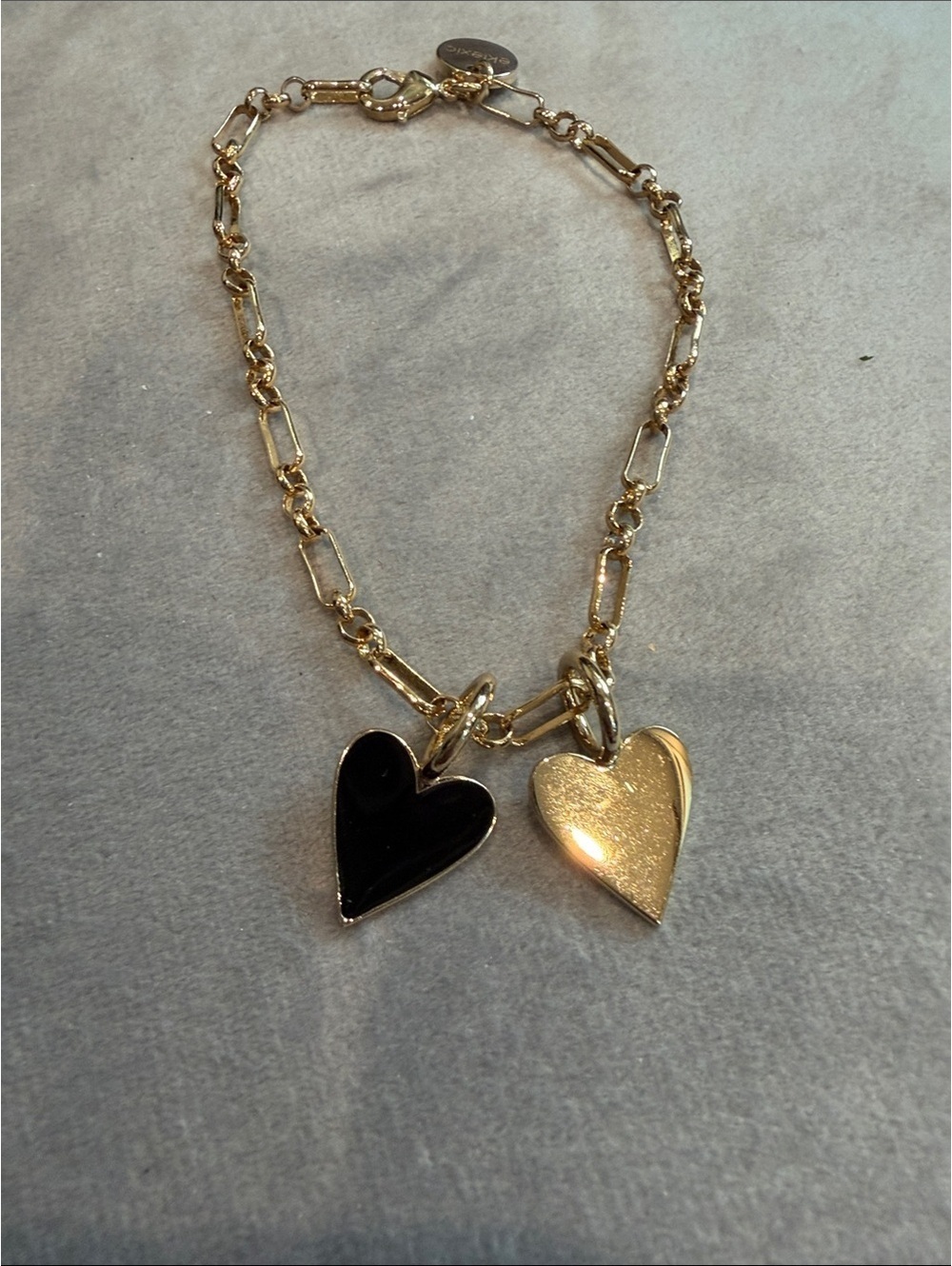 Eklexic Gold Tone Chain Bracelet with Black and Gold Heart Charms